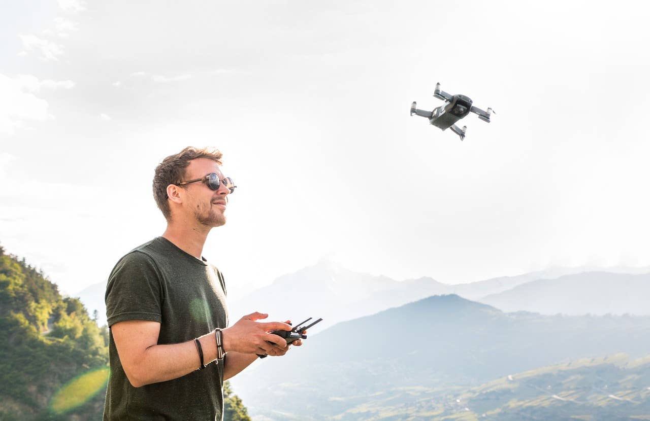 Man operating drone